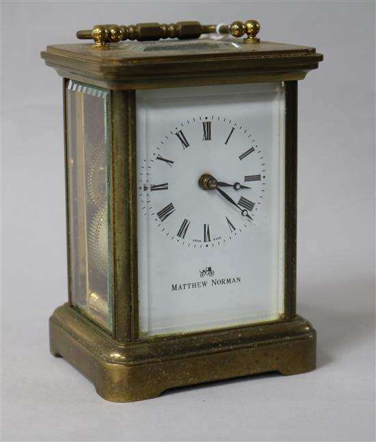 A gilt-brass carriage timepiece with white enamelled Roman dial 12cm.